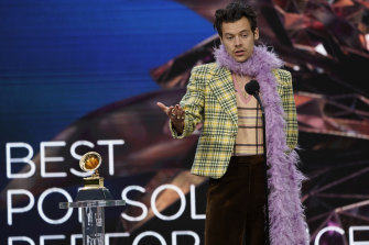 Harry Styles accepts the Grammy for best pop solo performance.