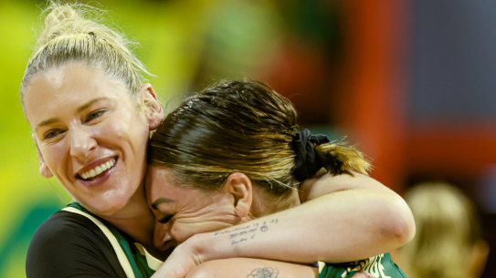 Lauren Jackson hugs Opals teammate Cayla George at the Olympics qualifying event in Brazil.