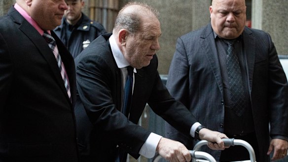 Harvey Weinstein, centre, arrives for a court hearing on Wednesday in New York.