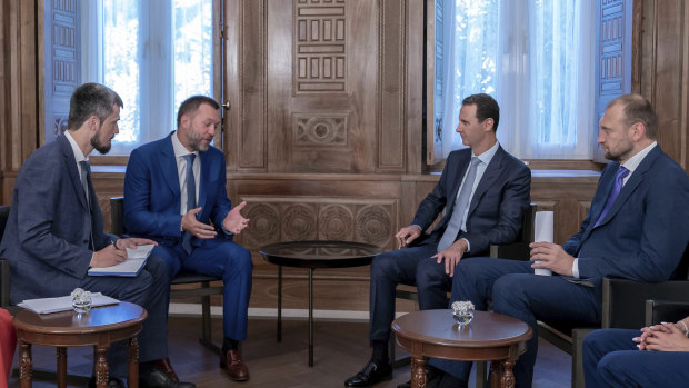 Syrian President Bashar al-Assad, second right, meets with a Russian delegation in Damascus on Tuesday. His forces are supported by Russia.