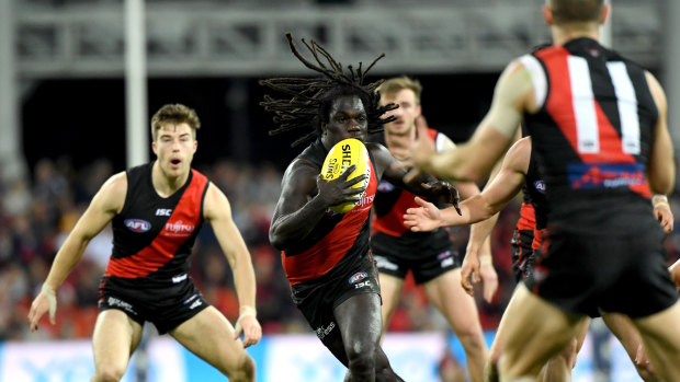 On the burst: Bomber Anthony McDonald-Tipungwuti emerges from the pack in possession.