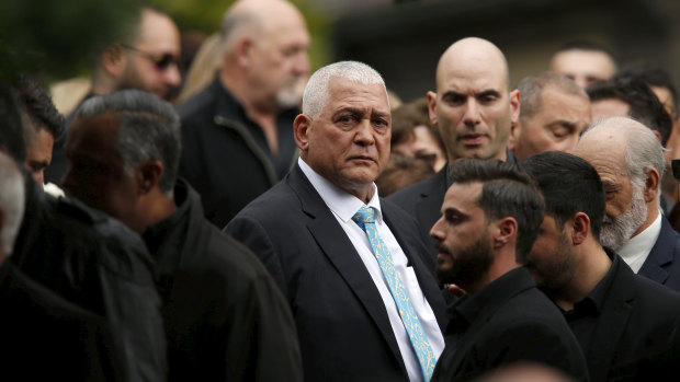  Mick Gatto is surrounded by friends and family at his son Justin's funeral.