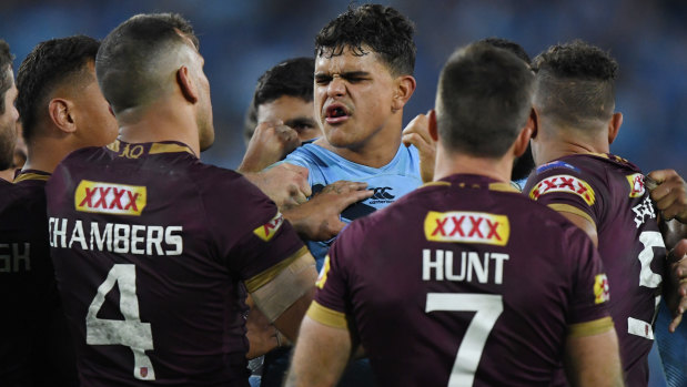 Running battle: Latrell Mitchell and Will Chambers were at each other all night.