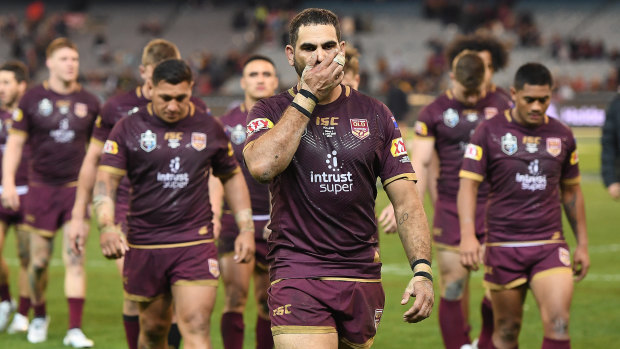 Greg Inglis of the Maroons leads his players from the ground after defeat in Origin I.