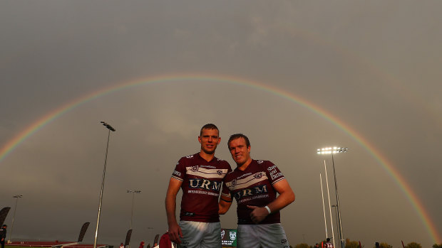 Tom and Jake Trbojevic enjoy the light show after the match at Glen Willow Sporting Complex on Saturday.