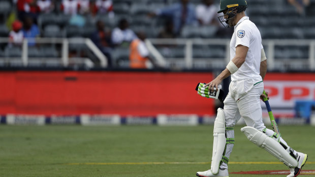 South Africa's captain Faf du Plessis leaves the field after being dismissed by Pat Cummins for a duck.