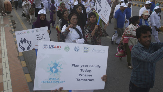 Pakistani activists take part in a World Population Day walk last month. 