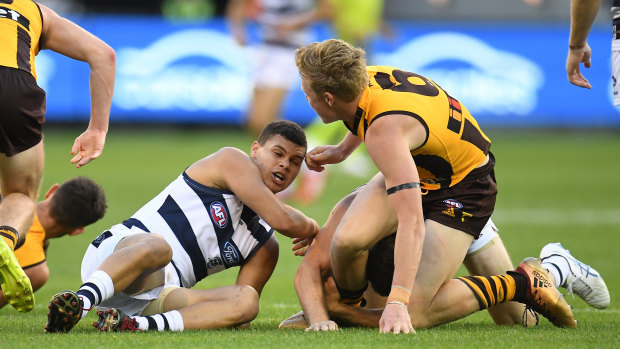 Joel Selwood (obscured) was not happy with James Sicily's treatment of him.