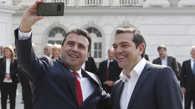 North Macedonia Prime Minister Zoran Zaev, left, takes a selfie with his Greek counterpart Alexis Tsipras.