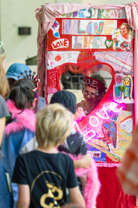 Crowds at the Biennale line up to visit Studio A artist Meagan Pelham’s love booth at White Bay.