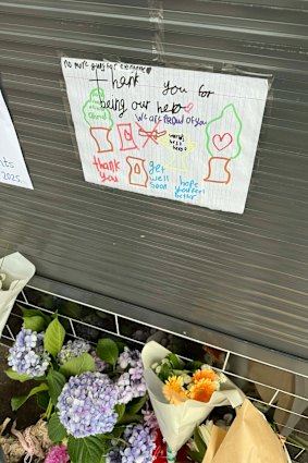 Flowers and tributes have been left outside Ahmed al Ahmed’s Sutherland Shire business.