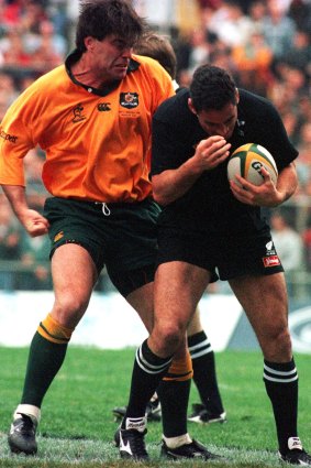 Michael Brial rains punches on New Zealand’s Frank Bunce at Lang Park. Amazingly, he stayed on the field.