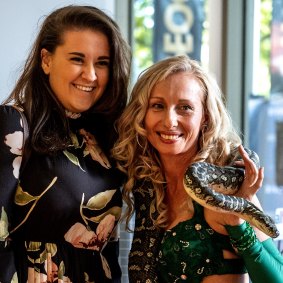 A guest at the Envie launch which featured live snakes.