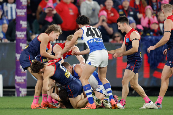 Players remonstrate after the half time siren.