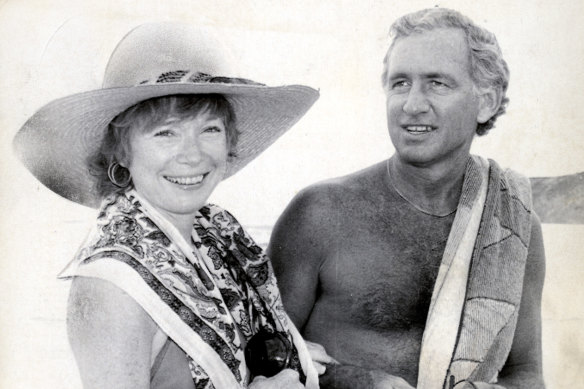 Federal MP Andrew Peacock and film star Shirley Maclaine strolling on a beach in 1982.