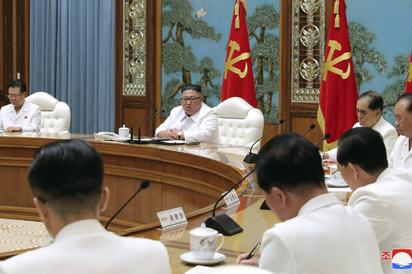 North Korean leader Kim Jong-un, centre, attends an emergency Politburo meeting in Pyongyang last month.