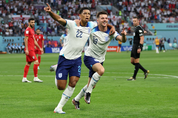 Jude Bellingham and Mason Mount celebrate the first of England’s six goals against Iran.