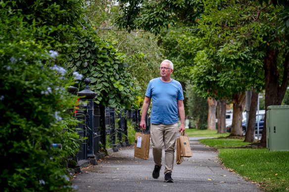 The retail term 'foot traffic' takes on new meaning for the Avenue Bookstore's Chris Redfern as he delivers books to customers' homes.