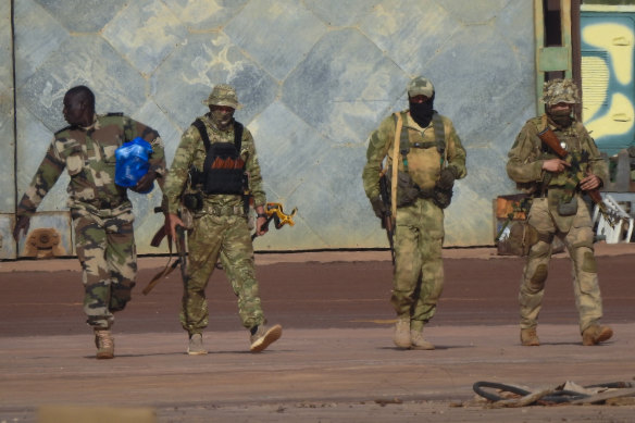 A photo released by the French military in 2022 purporting to show three Russian mercenaries, right, in northern Mali.