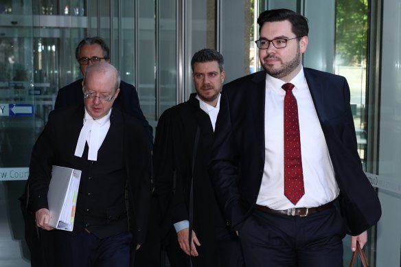 Bruce Lehrmann and his legal team leave the Federal Court in Sydney on Friday.