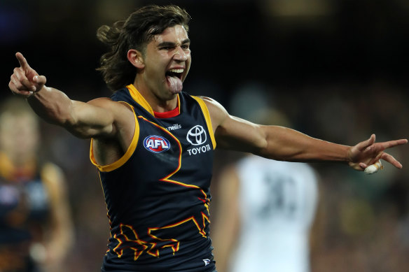 Josh Rachele of the Crows celebrates a goal.