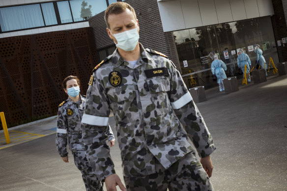 ADF troops help health workers at Epping Gardens Aged Care on Tuesday.