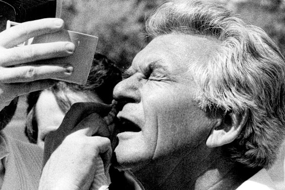 Prime Minister Bob Hawke is attended to after a cricket ball smashed his glasses into his eye in 1984.