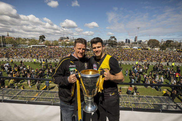 Coach Damien Hardwick and captain Trent Cotchin with the premiership cup at Punt Road on Sunday, where tens of thousands of Tiger faithful gathered to celebrate.