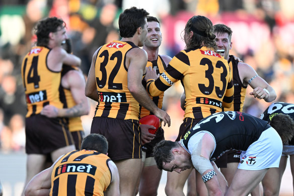 Hawthorn players celebrate their win over St Kilda at UTas Stadium in Launceston.