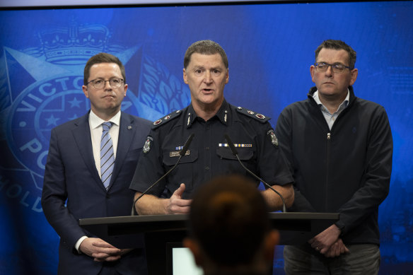Victoria Police Chief Commissioner Shane Patton speaks on Saturday, with Police Minister Anthony Carbines (left) and Premier Daniel Andrews.