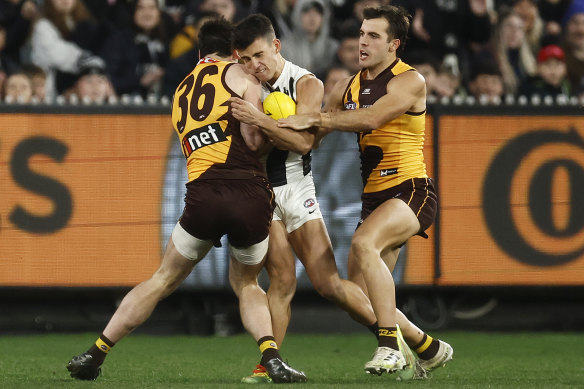 Rugged night: Nick Daicos collided with James Blanck and was hurt after this third term incident.