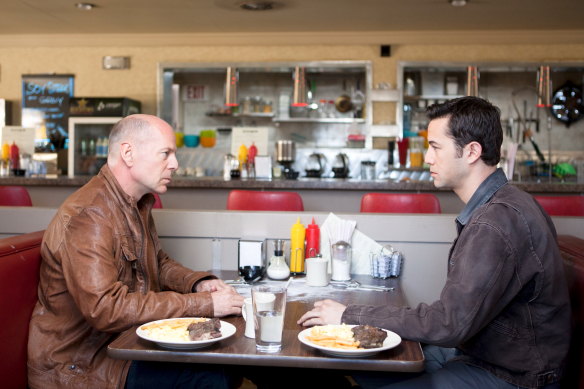 Bruce Willis and Joseph Gordon-Levitt in Looper.