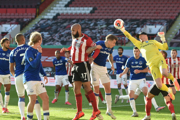 Jordan Pickford of Everton stretches for the ball during the Premier League match between Sheffield United and Everton FC at Bramall Lane.