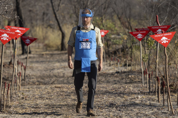 Britain's Prince Harry walks through a minefield in Dirico in Angola.