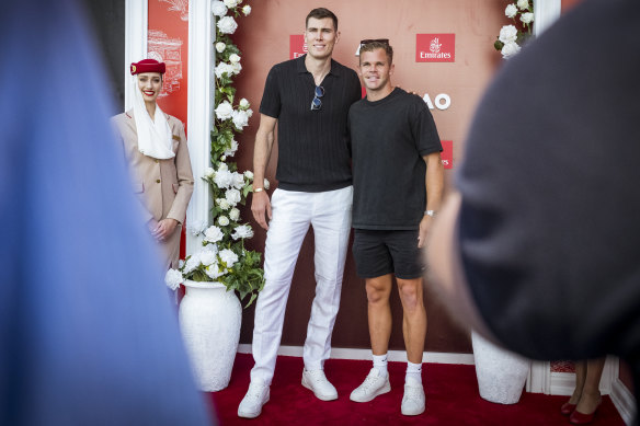 Mason Cox and fellow footballer Dan Houston in the Emirates marquee at the Australian Open on Tuesday.