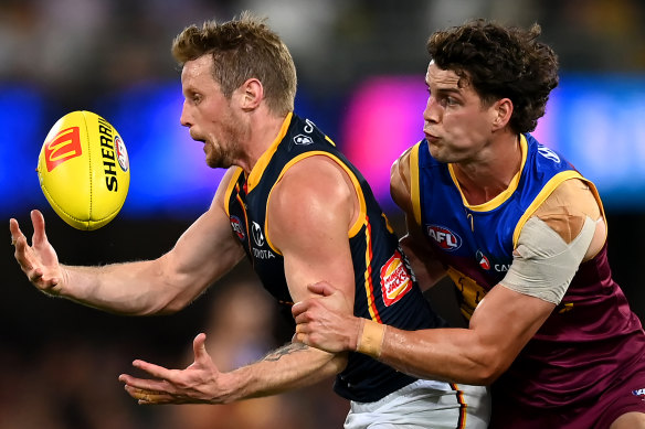 Rory Sloane is tackled under pressure.