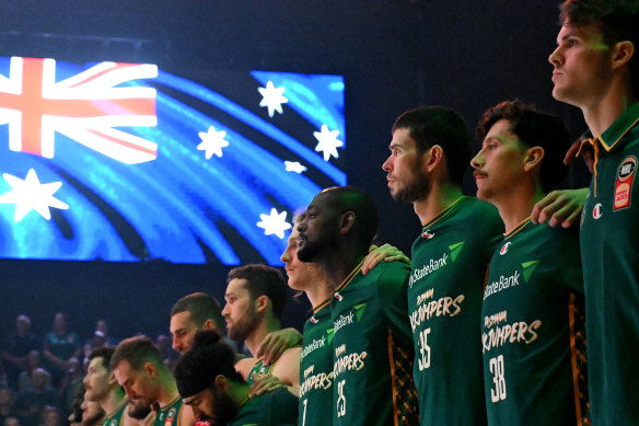 Jackjumpers players stand for the national anthem during game two of the NBL semi-final series against Perth Wildcats.