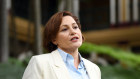 Jackie Trad says she is standing down from her ministerial duties amid a CCC probe.