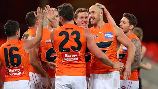 GOLD COAST, AUSTRALIA - JULY 25: Shane Mumford of the GWS Giants celebrates his goal during the round 19 AFL match between Essendon Bombers and Greater Western Sydney Giants at Metricon Stadium on July 25, 2021 in Gold Coast, Australia. (Photo by Kelly Defina/Getty Images)