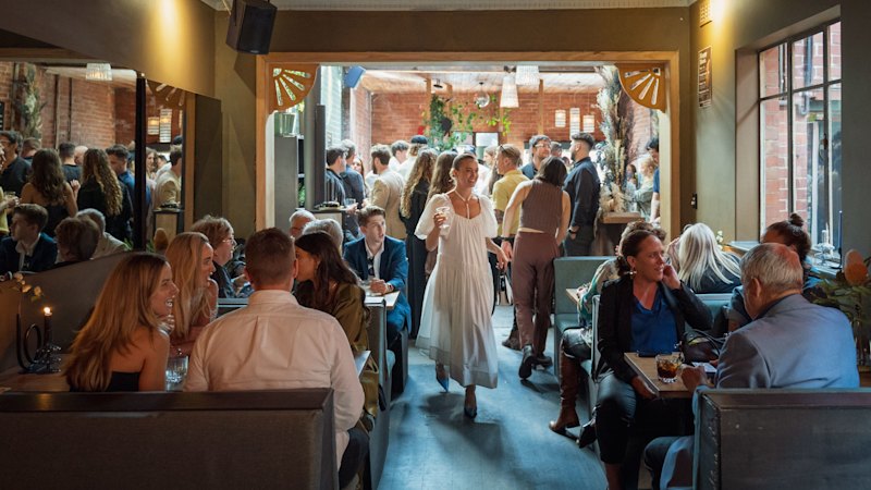 An indoor-outdoor bar with daily happy hour prices and pizzas until 3am