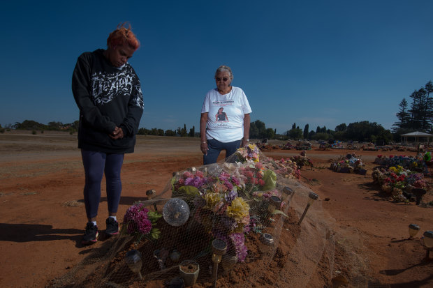 Sherona Roe and Carol Roe at the grave of  Ms Dhu in the Geraldton cemetery. 