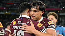 Tino Fa’asuamaleaui embraces Queensland teammate Kulikefu Finefeuiaki after defeating the NSW Blues.