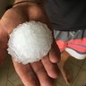 'Cricket-ball sized hail' hammers areas west of Brisbane as severe storms sweep through