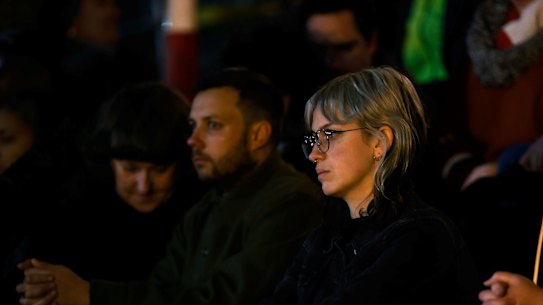 People attend a vigil for Natalina Angok at Parliament House on Friday.