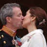 Danish King Frederik X and Queen Mary kiss on the balcony of Christiansborg Palace.