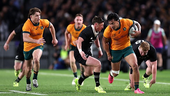 Len Ikitau of Australia charges forward.