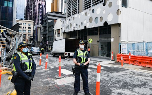 Police in front of the Brady Hotel.