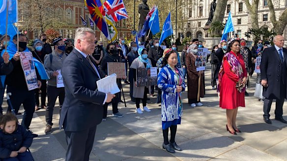 Rahima Mahmut from the World Uighur Congress with Conservative MPs Nus Ghani and Sir Iain Duncan Smith in London address a gathering before the genocide vote.