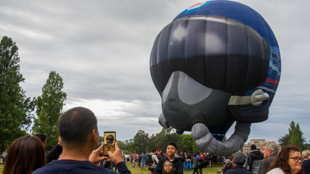 A Royal Australian Air Force hot air balloon shaped like a pilot's helmet.
