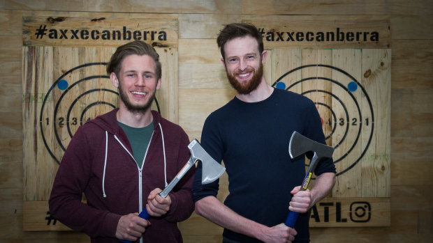 Axxe Canberra owner Chris Krajacic with manager
Andrew Grimmett say hurling hatchets is not just for lumberjacks.